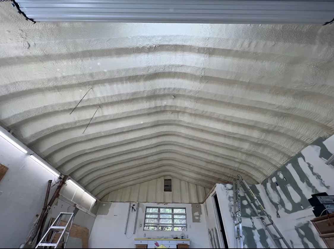 Spray polyurethane foam applied to the underside of a metal roof deck in Cedar Grove